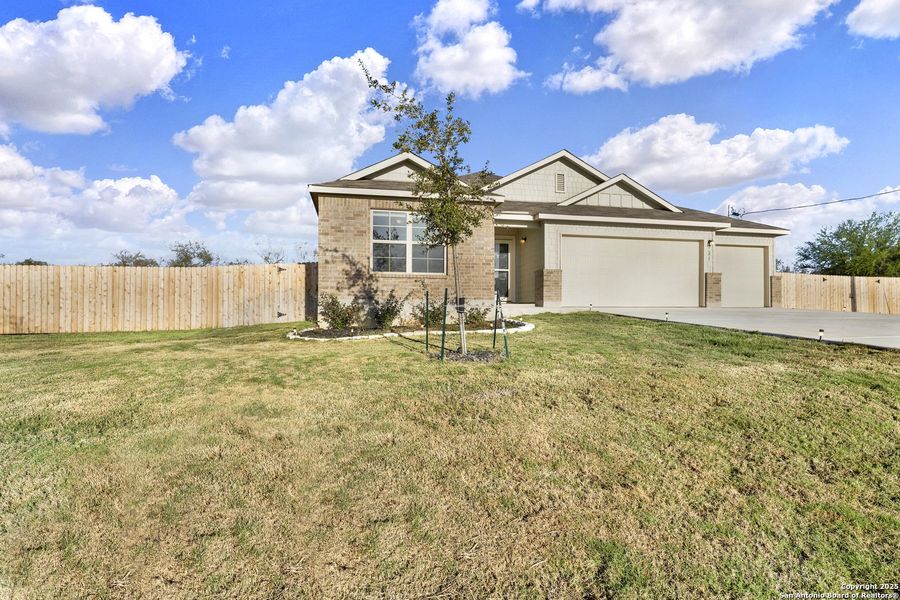 Front exterior of a new home in Chaparral Ranch, Floresville, TX, highlighting curb appeal (Image 20).
