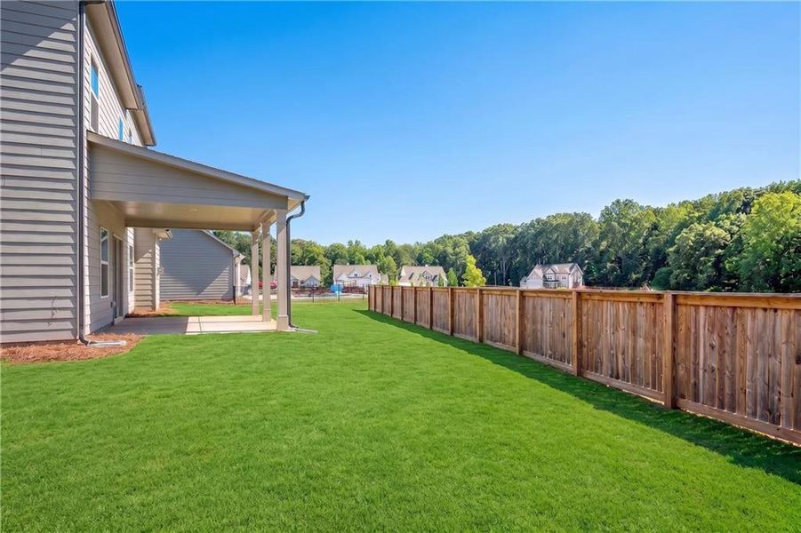 Exterior details and patio area of a home in Hidden Fields, Hoschton (Image 28).