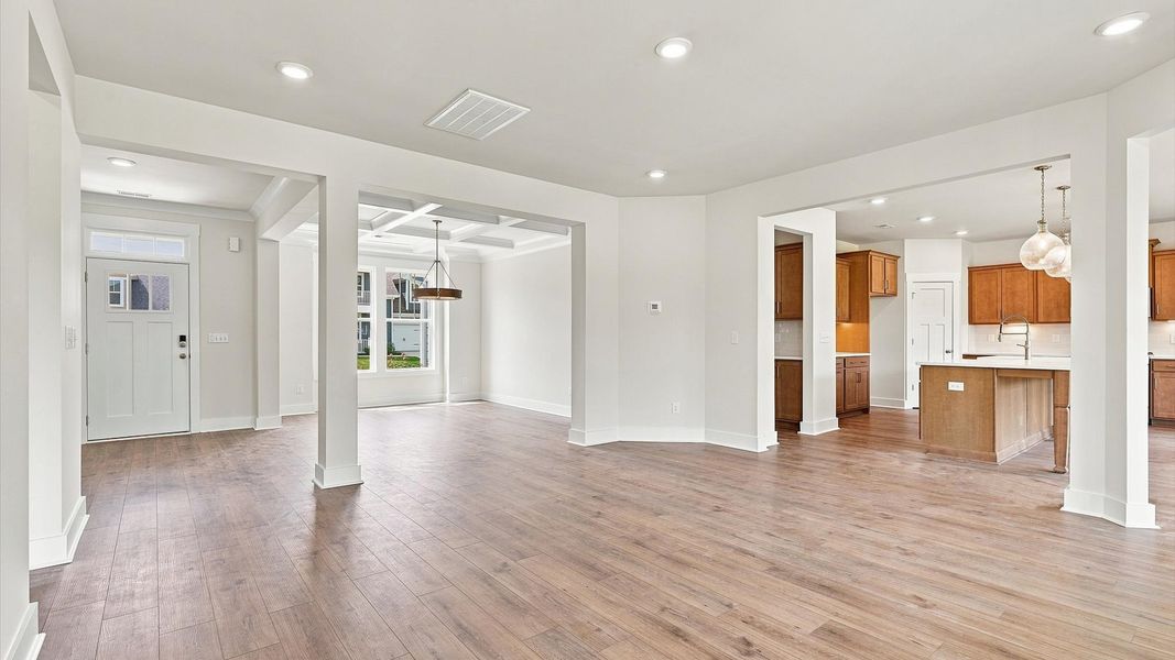 Exceptional family space with hardwood floors and seamless flow to dining and kitchen areas