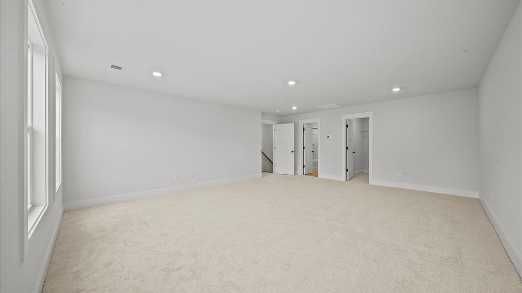Memorable space offering plush carpet underfoot and a thoughtfully planned walk-in closet and en suite bathroom