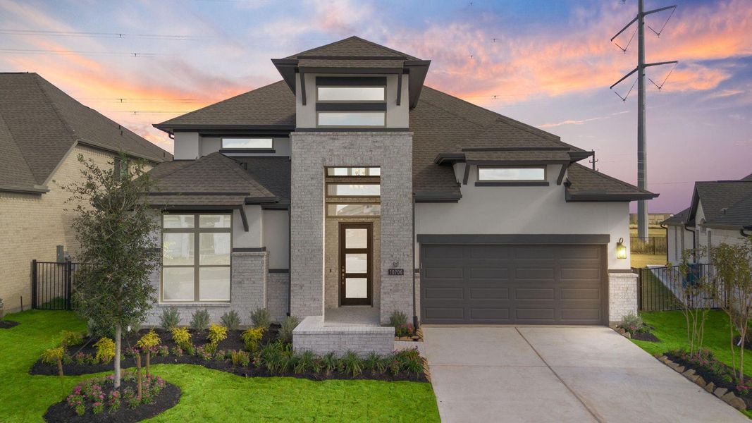 Front exterior of a new home in Bridgeland 55', Cypress, TX, highlighting curb appeal (Image 1).