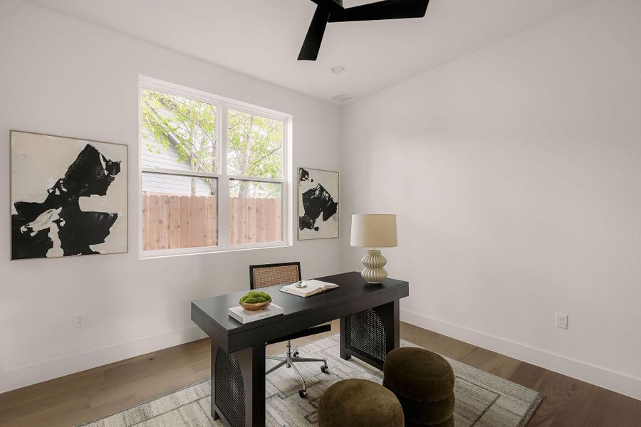 Office space featuring wood finished floors and ceiling fan Office space featuring wood finished floors and ceiling fan