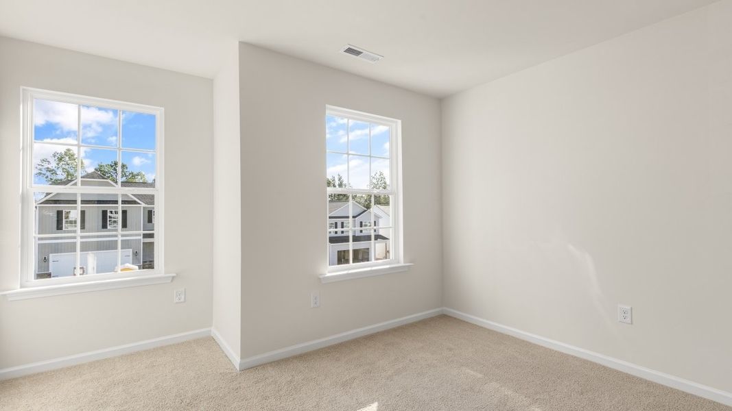 Spacious, unfurnished interior of a new home in The Grove at Matthews Landing, Fuquay Varina (Image 32).