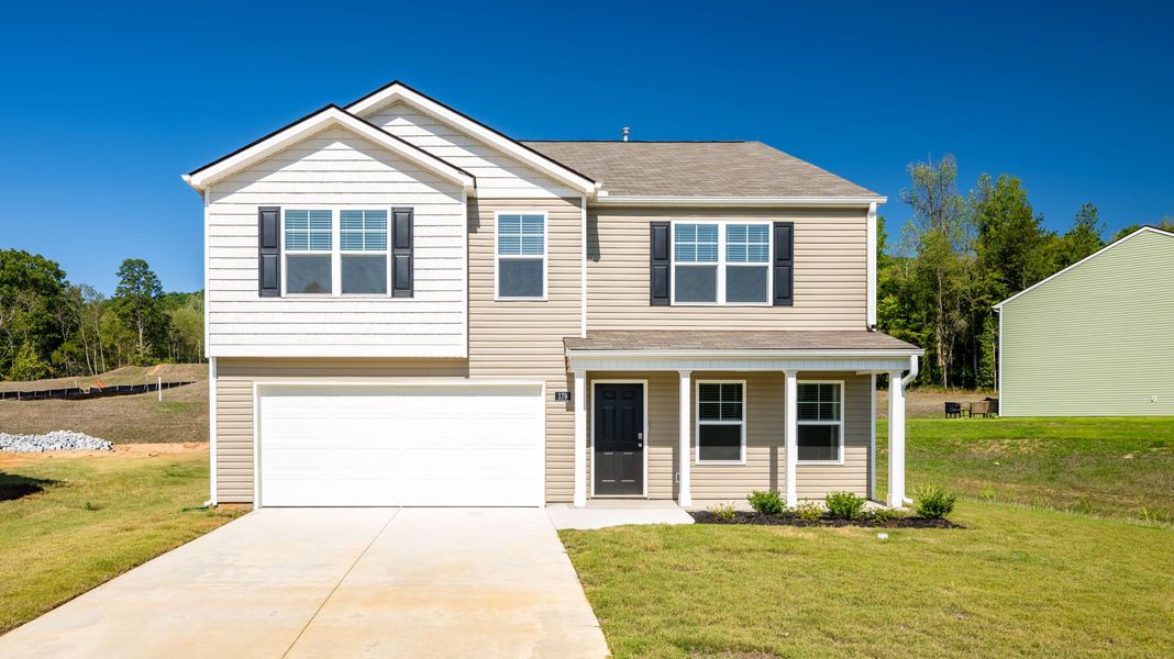 Front exterior of a new home in Hawk's Ridge, Rossville, GA, highlighting curb appeal (Image 2).