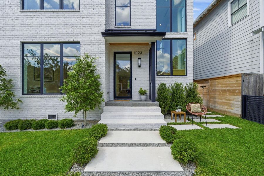 Inviting front door with nearby patio for watching neighbors go by or kids play! Inviting front door with nearby patio for watching neighbors go by or kids play!