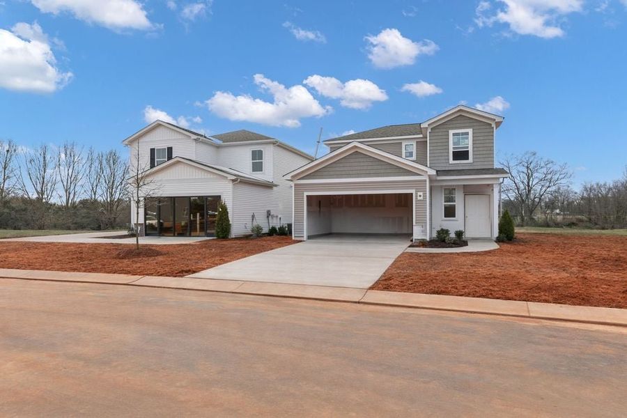 Front exterior of a new home in Fincastle Glen, Shelby, NC, highlighting curb appeal (Image 2). Front exterior of a new home in Fincastle Glen, Shelby, NC, highlighting curb appeal (Image 2).