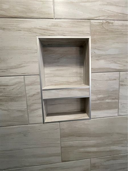 This sleek shower niche provides convenient, built