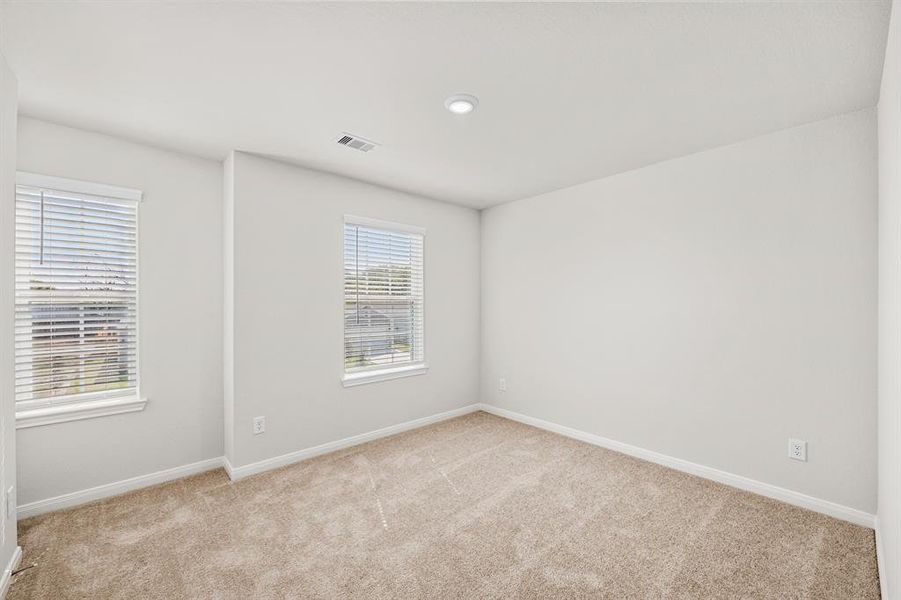 One of the three additional bedrooms in the home.