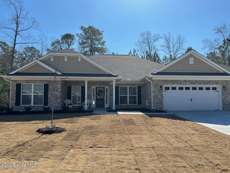 Front exterior of a new home in Palmetto Creek, Bolivia, NC, highlighting curb appeal (Image 1). Front exterior of a new home in Palmetto Creek, Bolivia, NC, highlighting curb appeal (Image 1).
