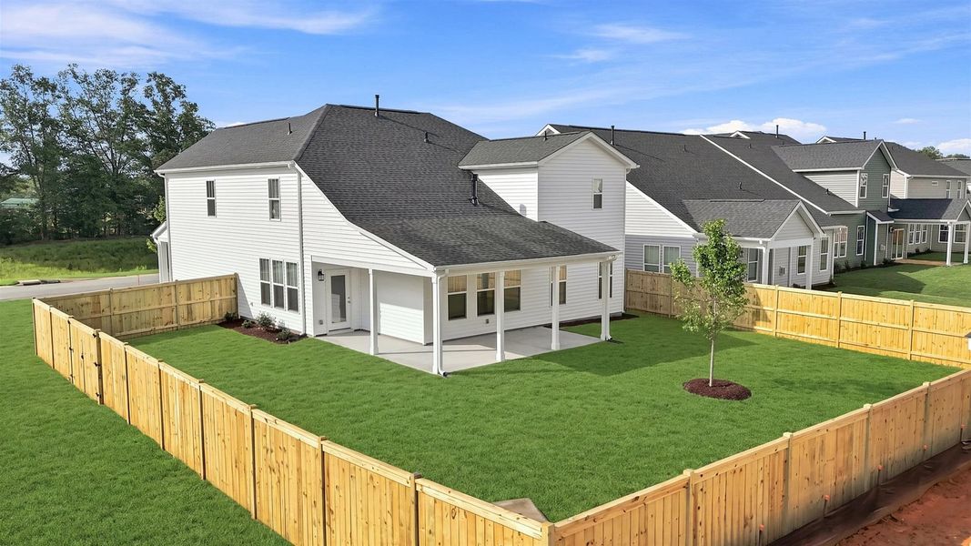 Highly functional rear covered porch adds memorable living space to this elegant home by DRB Homes