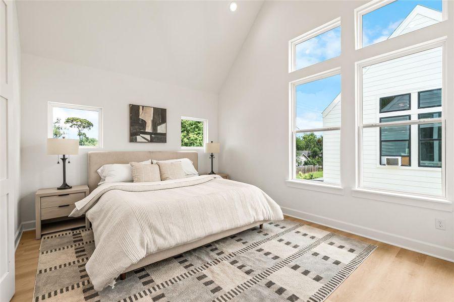 Vaulted ceilings, deliberate window placement — natural light engineered into the primary suite Vaulted ceilings, deliberate window placement — natural light engineered into the primary suite