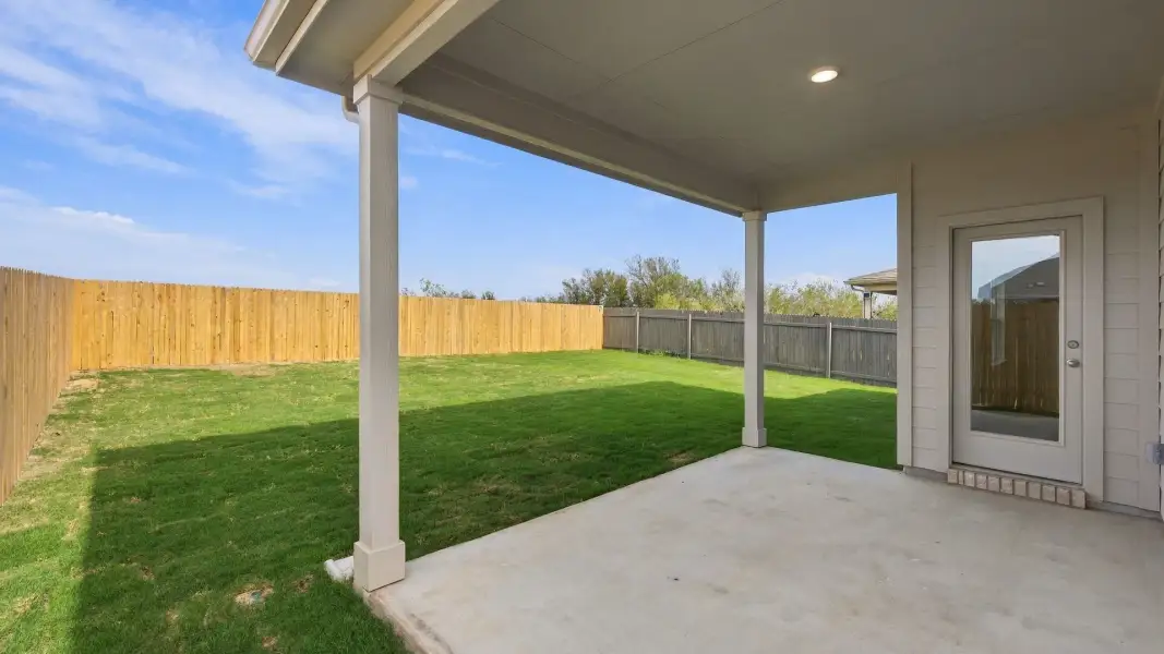 Exterior details and patio area of a home in Carillon, Manor (Image 3).