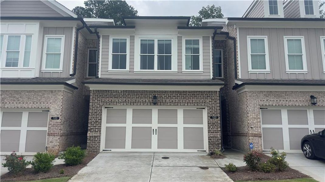 Front exterior of a new home in , Cumming, GA, highlighting curb appeal (Image 2). Front exterior of a new home in , Cumming, GA, highlighting curb appeal (Image 2).
