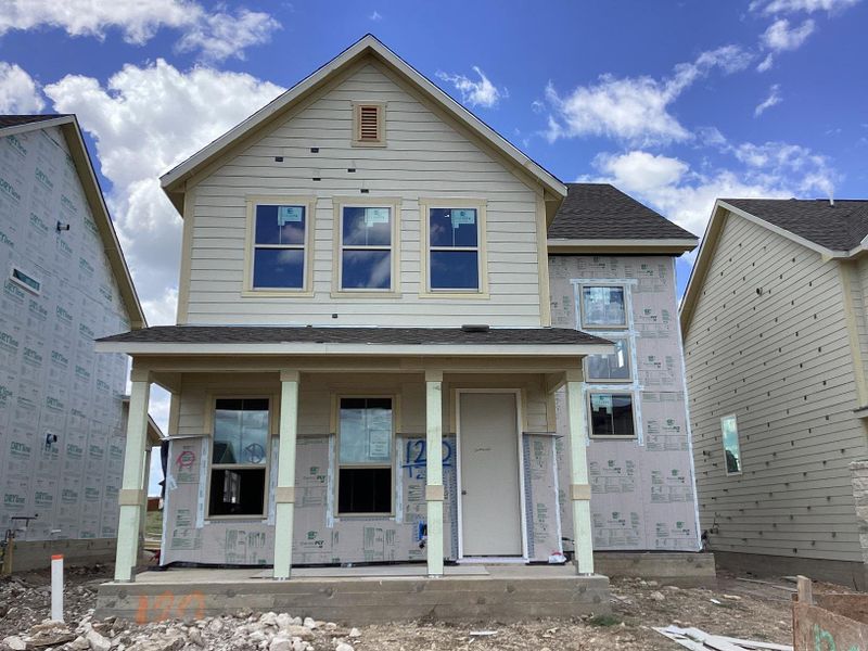 Front exterior of a new home in The Cottages at Lariat, Liberty Hill, TX, highlighting curb appeal (Image 16). Front exterior of a new home in The Cottages at Lariat, Liberty Hill, TX, highlighting curb appeal (Image 16).