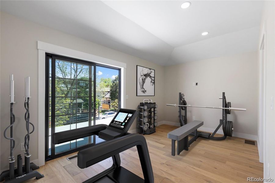 Loft that opens to a large rooftop deck throughmodern sliding doors (virtually staged to showdesign options) Loft that opens to a large rooftop deck throughmodern sliding doors (virtually staged to showdesign options)