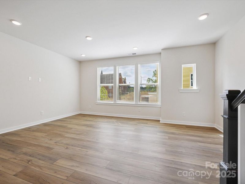 Spacious, unfurnished interior of a new home in Central Living at Craig, Charlotte (Image 20).