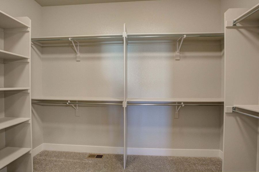 Primary Closet - Not Actual Home - Finishes May Vary