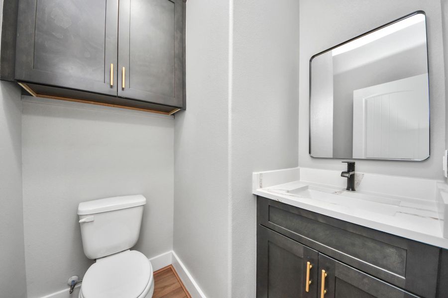 Half bath with new cabinets.