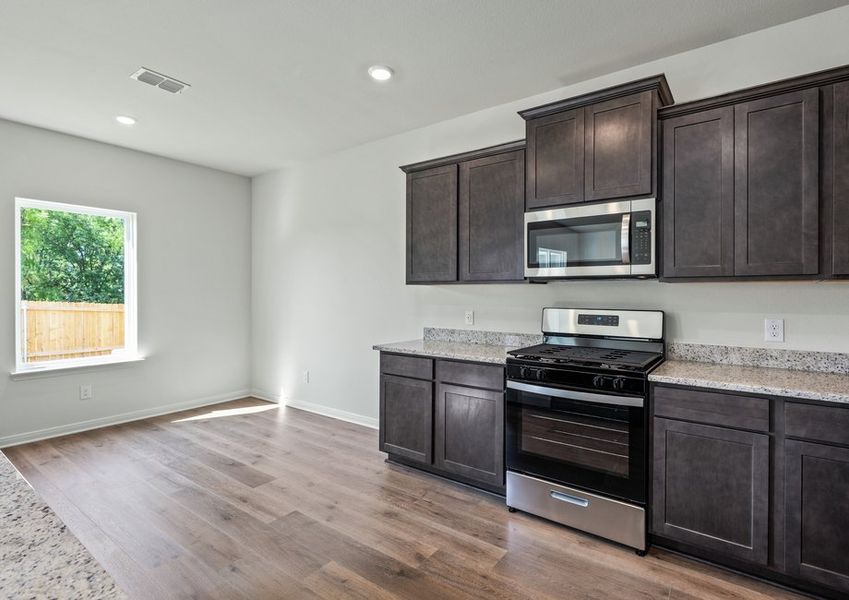 The dining room sits adjacent to the kitchen.