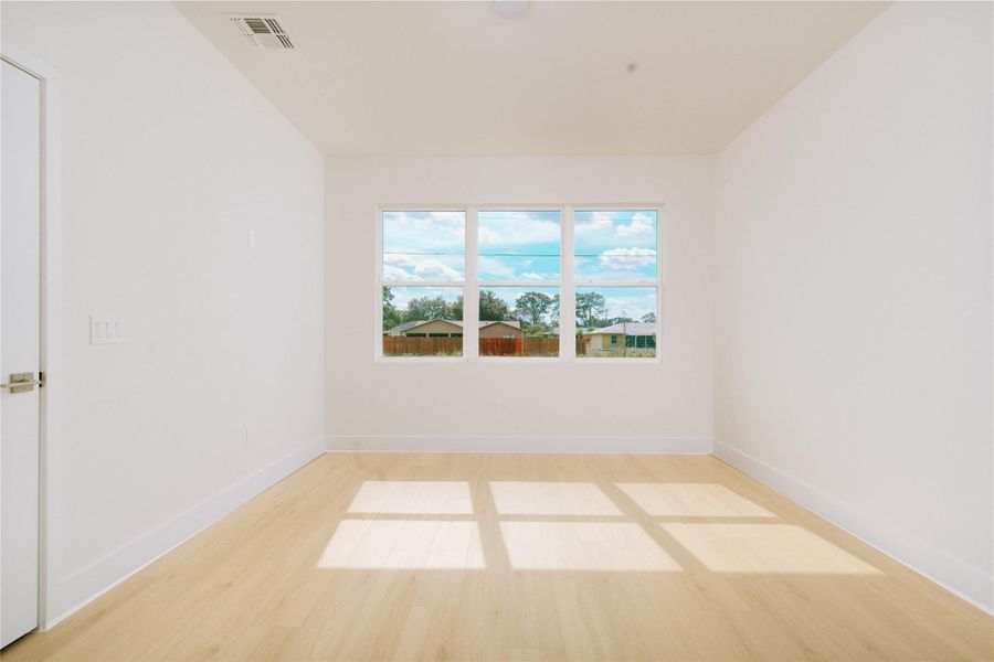 Plenty of natural light flooding the primary bedroom