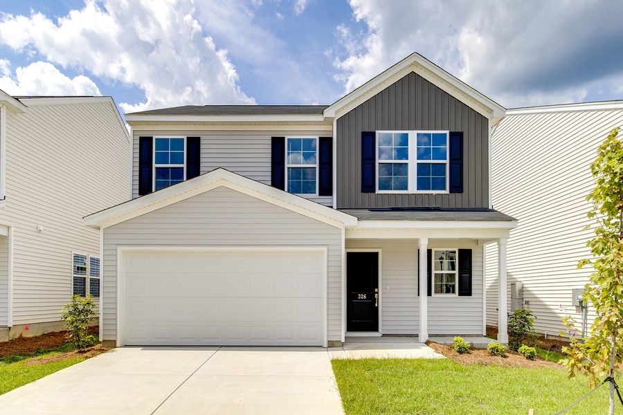 Front exterior of a new home in Winston Point, Gilbert, SC, highlighting curb appeal (Image 1). Front exterior of a new home in Winston Point, Gilbert, SC, highlighting curb appeal (Image 1).