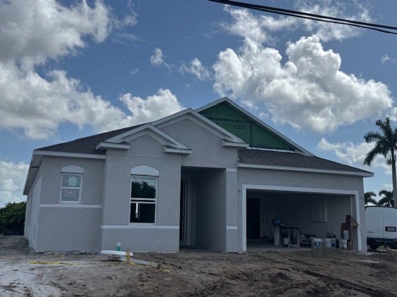 Front exterior of a new home in Cape Coral, Cape Coral, FL, highlighting curb appeal (Image 1). Front exterior of a new home in Cape Coral, Cape Coral, FL, highlighting curb appeal (Image 1).