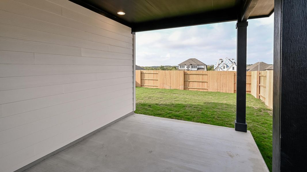 Fenced backyard with a patio Fenced backyard with a patio