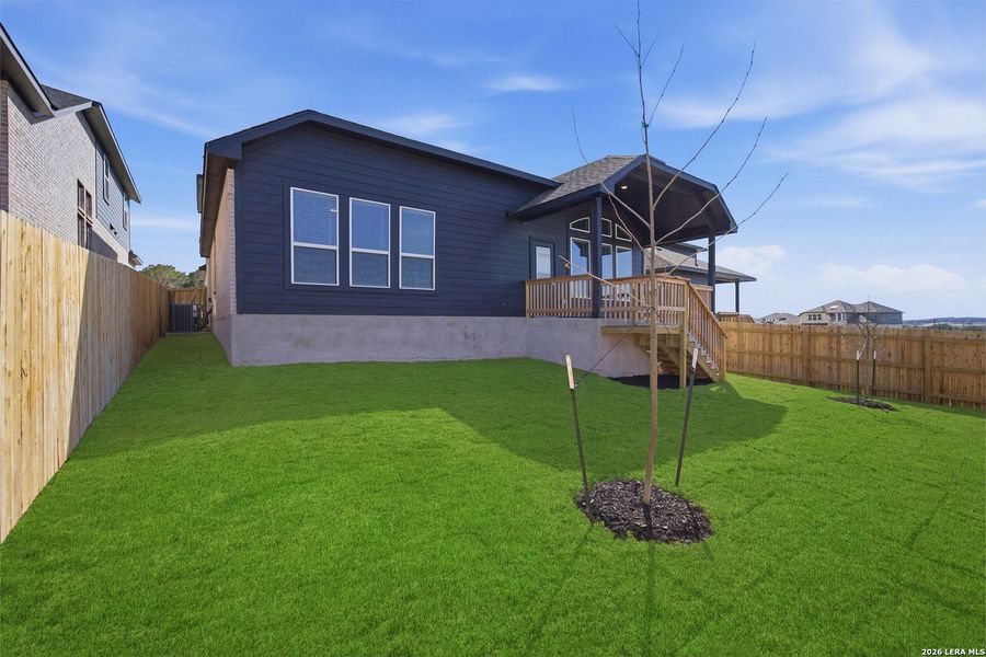 Exterior details and patio area of a home in The Woodlands at Medina Hills, Mico (Image 24).