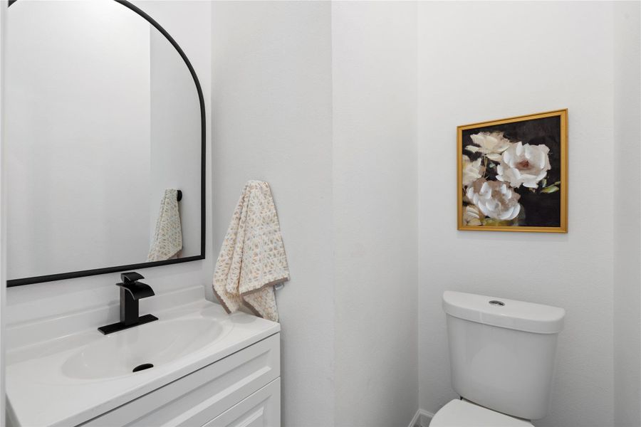 Half bath on the main floor with stylish finishes — convenient for guests and everyday use. Half bath on the main floor with stylish finishes — convenient for guests and everyday use.