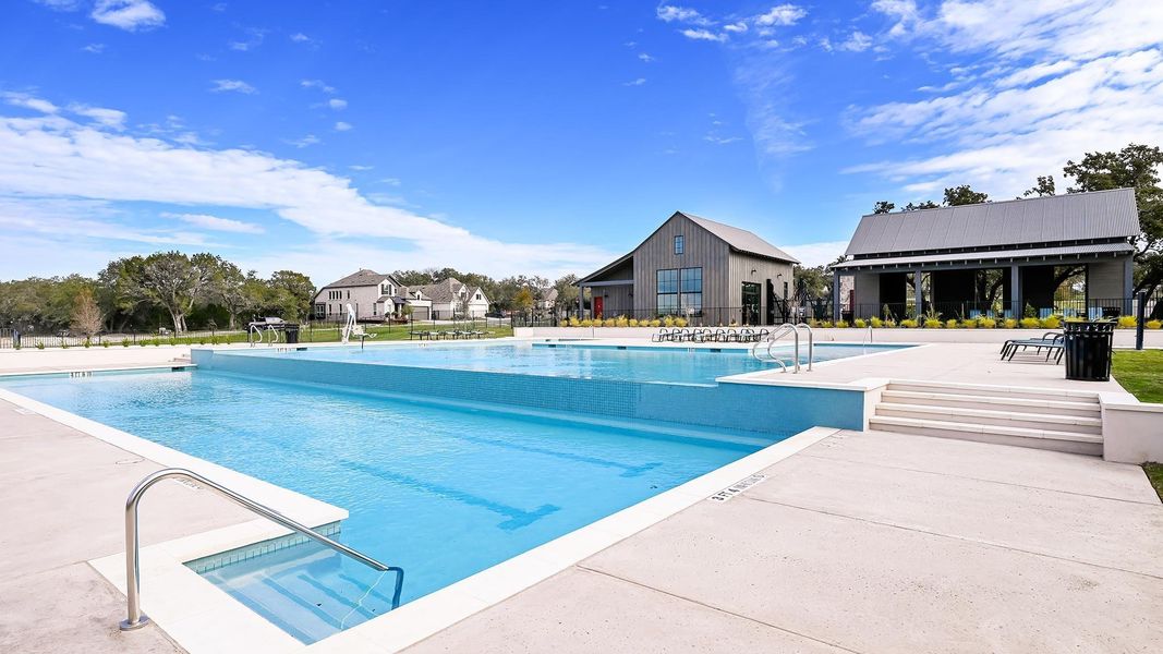 Pool featuring a patio area and fence