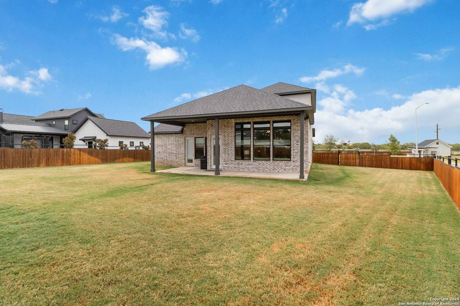Front exterior of a new home in Woodbridge Farms, La Vernia, TX, highlighting curb appeal (Image 25).
