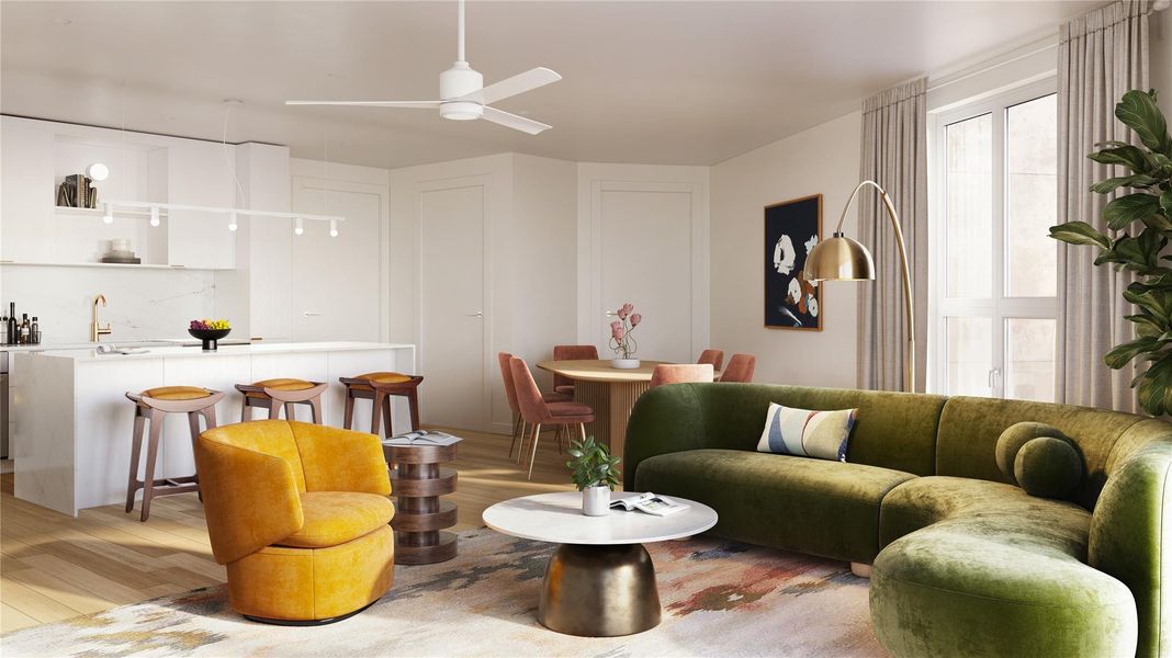 An open floor plan shown in the Skylark finish palette, fully furnished with Williams Sonoma selections featuring hotel level fabrics and curated accents throughout.