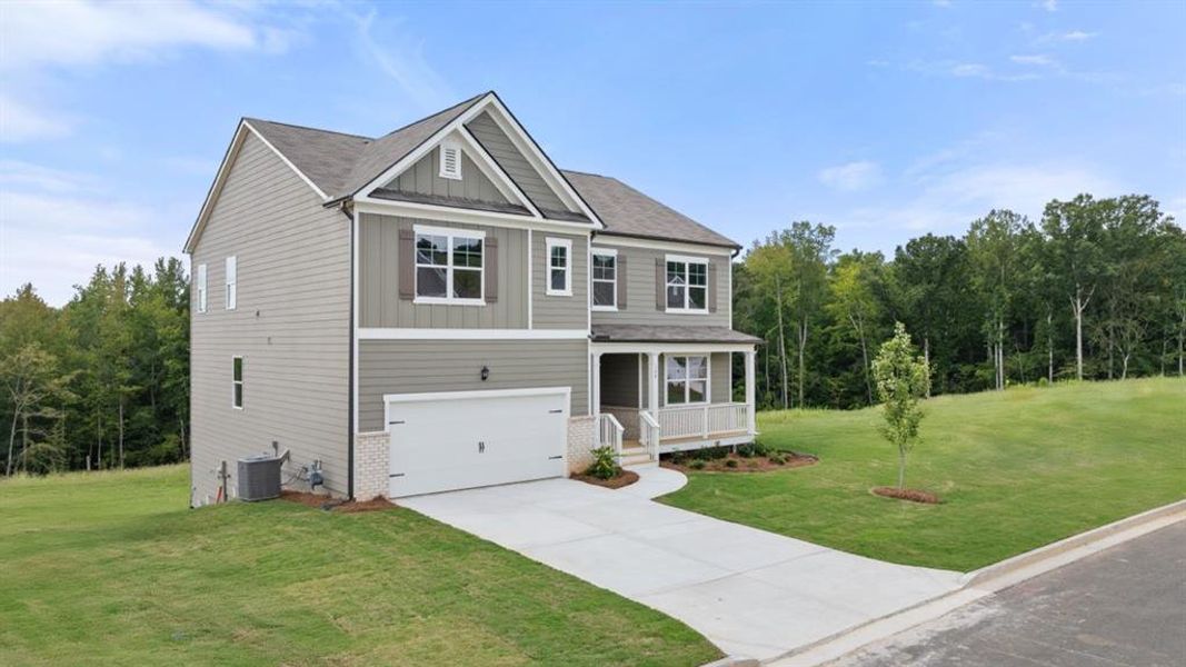 Front exterior of a new home in Sheffield Highlands, Dallas, GA, highlighting curb appeal (Image 24).