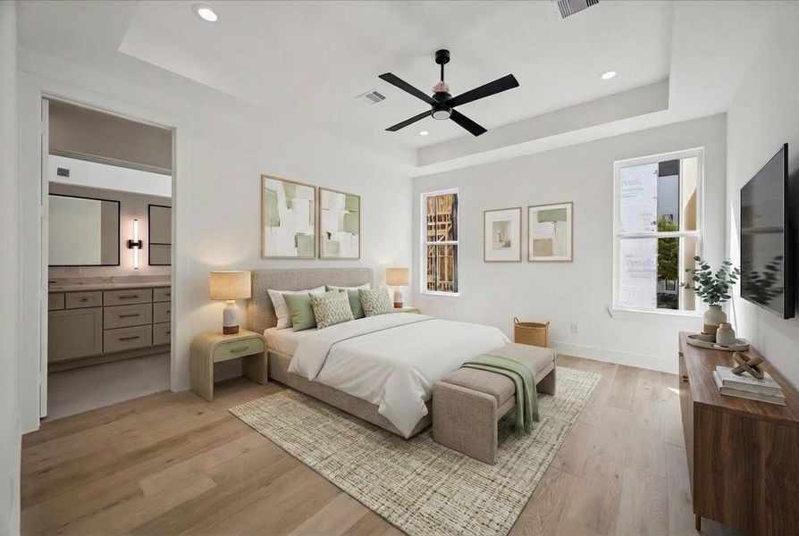 The primary suite bedroom has high coffered ceilings . There are Beautiful light hardwoods throughout the home.
