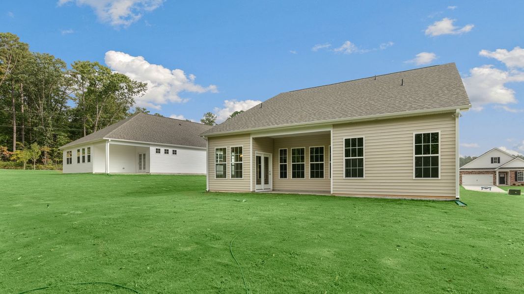 Exterior details and patio area of a home in The Villas at Martin Farms, Aberdeen (Image 21).