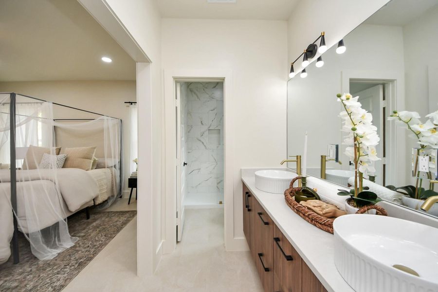 Seamless flow from the primary bedroom into the spa-like bathroom.
