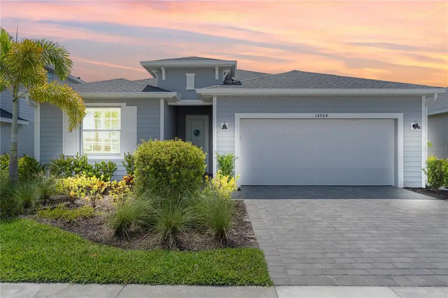 Front exterior of a new home in , Punta Gorda, FL, highlighting curb appeal (Image 1). Front exterior of a new home in , Punta Gorda, FL, highlighting curb appeal (Image 1).