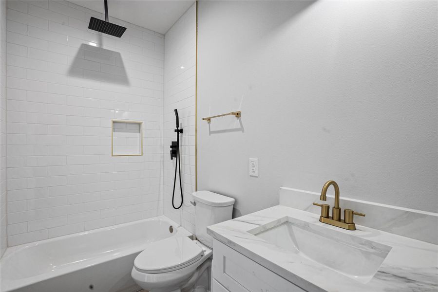 Full bathroom featuring vanity and a combined bath / shower with rainfall shower
