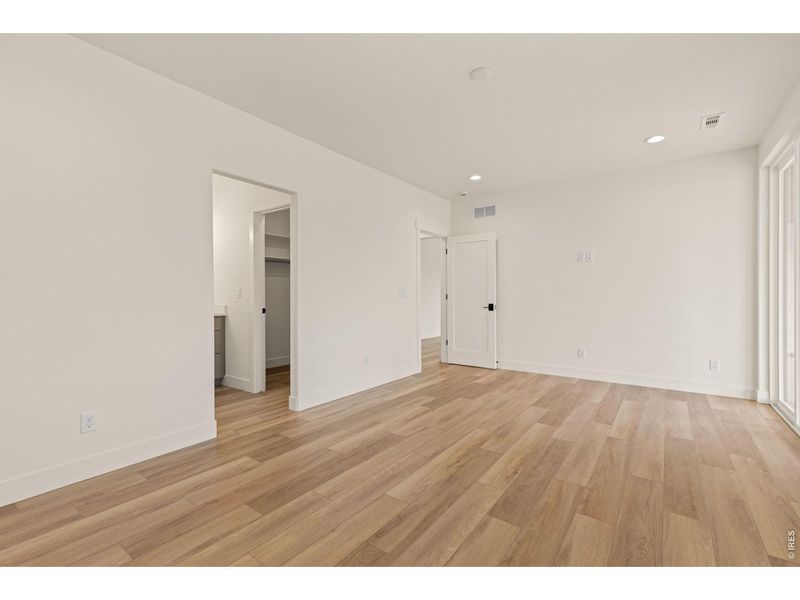 Spacious, unfurnished interior of a new home in RainDance, Windsor (Image 21).