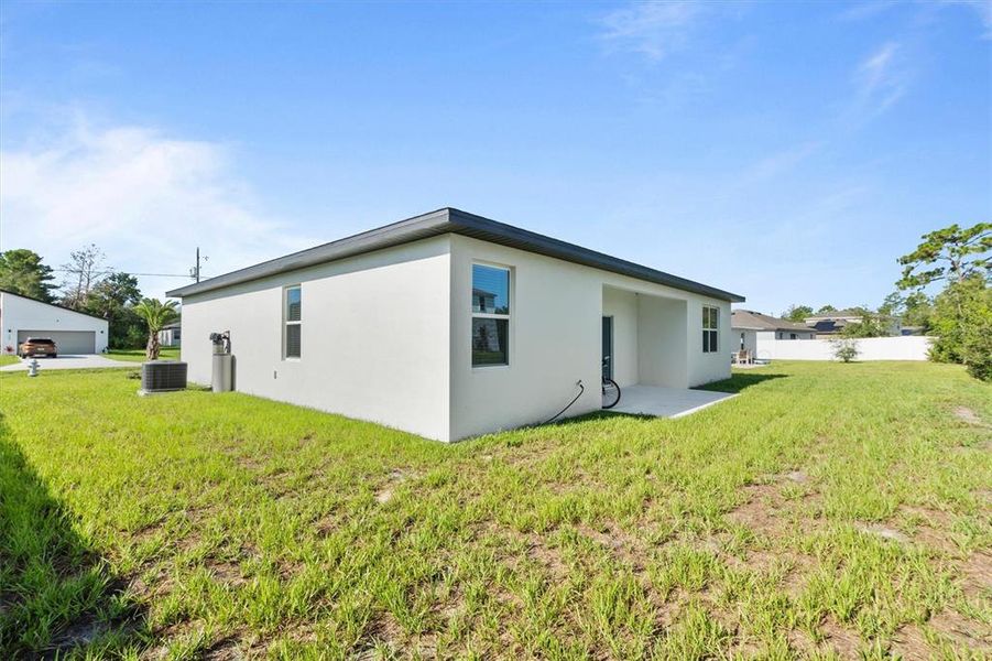 Front exterior of a new home in , Kissimmee, FL, highlighting curb appeal (Image 22).