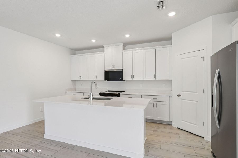 Furnished interior view inside a new home in Colbert Landings, Palm Coast (Image 12).