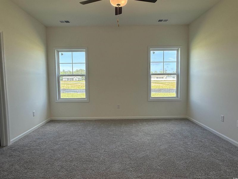 Corridor with wood finished floors and baseboards Corridor with wood finished floors and baseboards