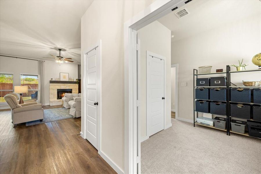 Corridor with baseboards and carpet