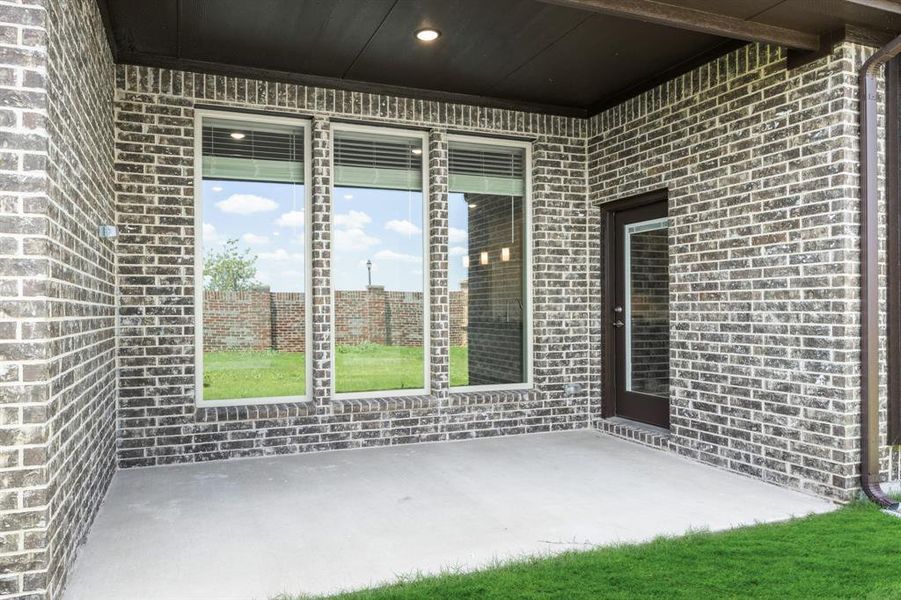 Exterior details and patio area of a home in The Oaks, Red Oak (Image 25). Exterior details and patio area of a home in The Oaks, Red Oak (Image 25).