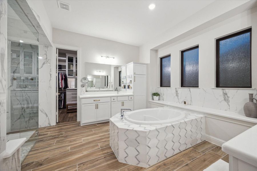 "Her" side of the primary bathroom with vanity drawer and extra linen cabinet. "Her" side of the primary bathroom with vanity drawer and extra linen cabinet.