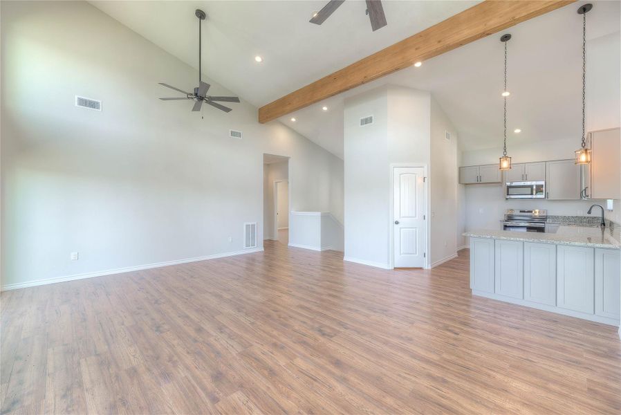 ANOTHER VIEW OF LIVING AREA AND KITCHEN