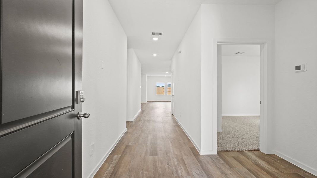 Spacious, unfurnished interior of a new home in Sunterra, Katy (Image 11).