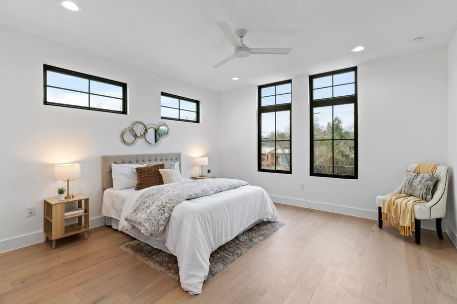 Bedroom featuring recessed lighting, baseboards, light wood-style flooring, and ceiling fan