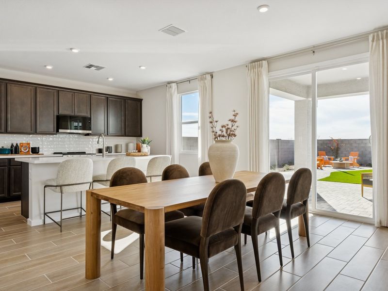 A kitchen with a dining table. A kitchen with a dining table.