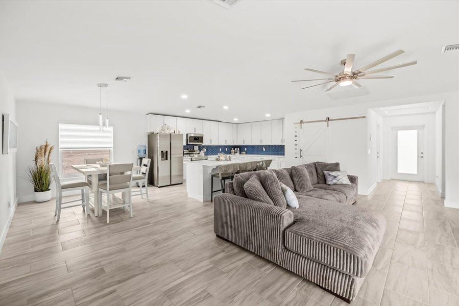 Seamless Open-Concept Living: Integrated Family Room, Dining, and Kitchen